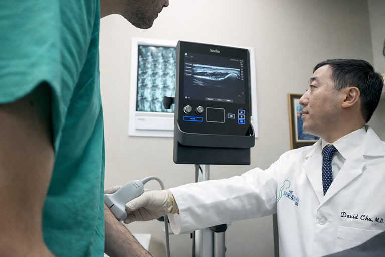 Patient receiving personalized care and consultation at spine and rehab clinic in Englewood Cliffs NJ